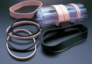 Bag of pink Static Dissipative and black Conductive ESD rubber bands.